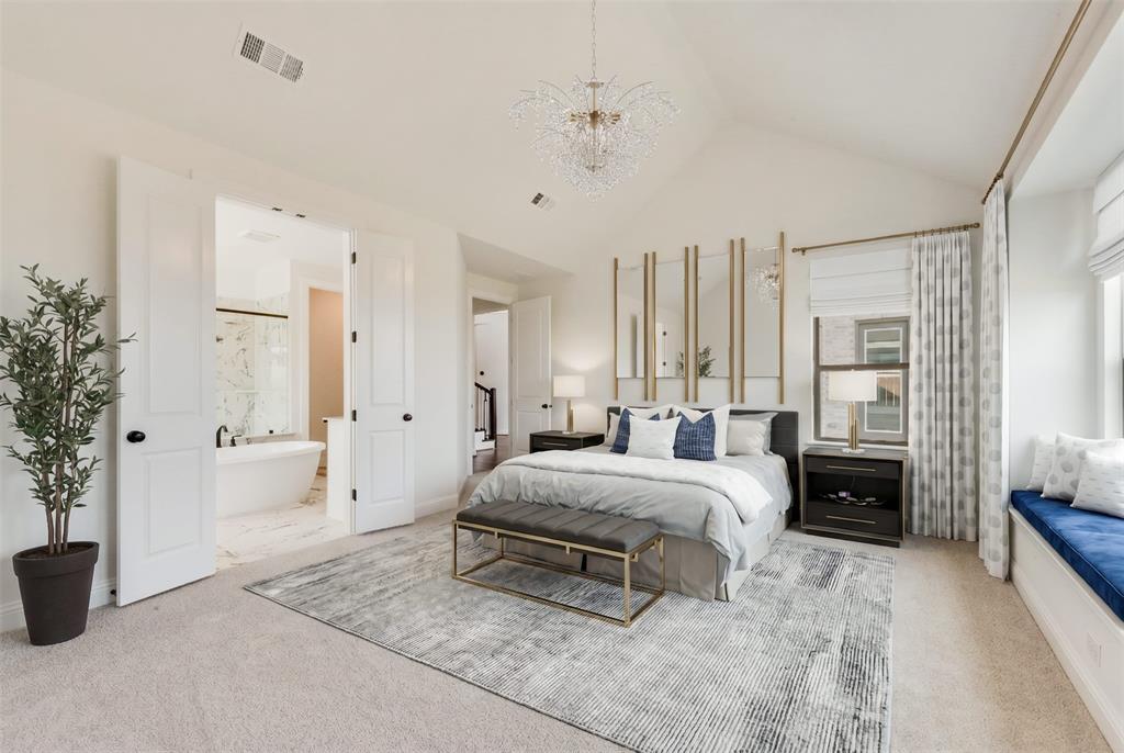 511 San Angelo Drive Forney, TX 75126 - Photo 15 of 34 a spacious bedroom with a bed a couch and a large window
