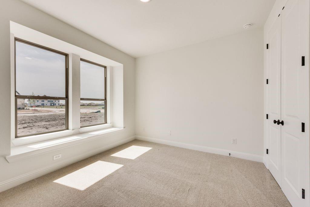 511 San Angelo Drive Forney, TX 75126 - Photo 21 of 34 a view of an empty room with a window