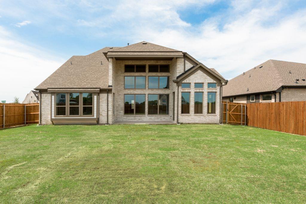 511 San Angelo Drive Forney, TX 75126 - Photo 31 of 34 a front view of a house with a garden