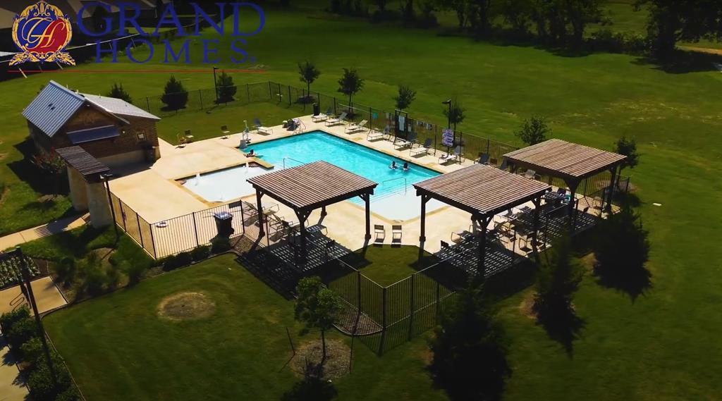 511 San Angelo Drive Forney, TX 75126 - Photo 32 of 34 an aerial view of a house with garden space and lake view