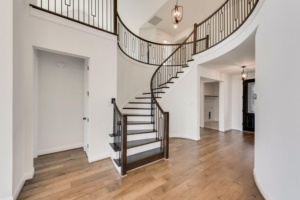 511 San Angelo Drive Forney, TX 75126 - Photo 5 of 34 a view of entryway with stairs and wooden floor