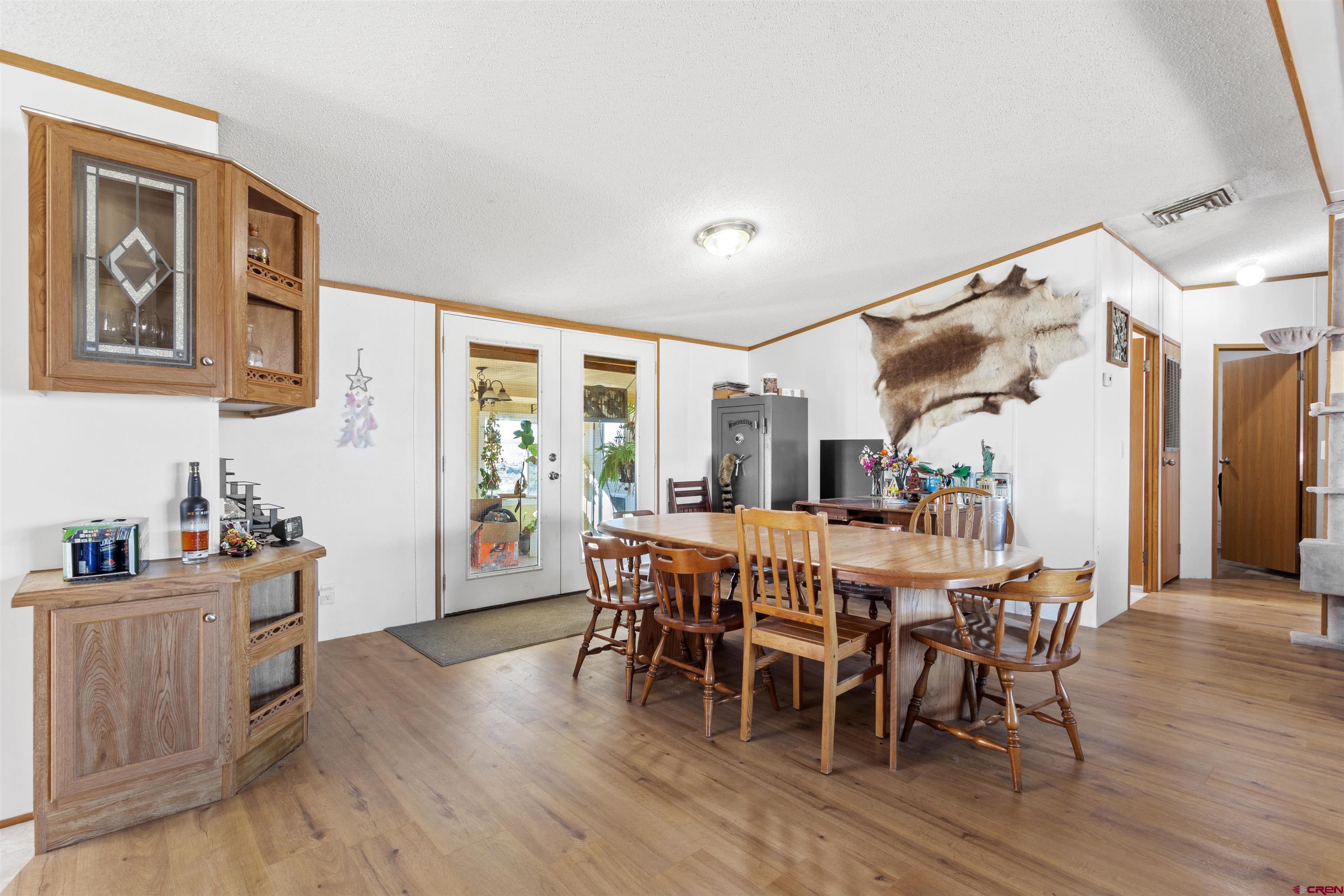 23384 D50 Road Delta, CO 81416 - Photo 15 of 37 a view of a dining room with furniture and wooden floor