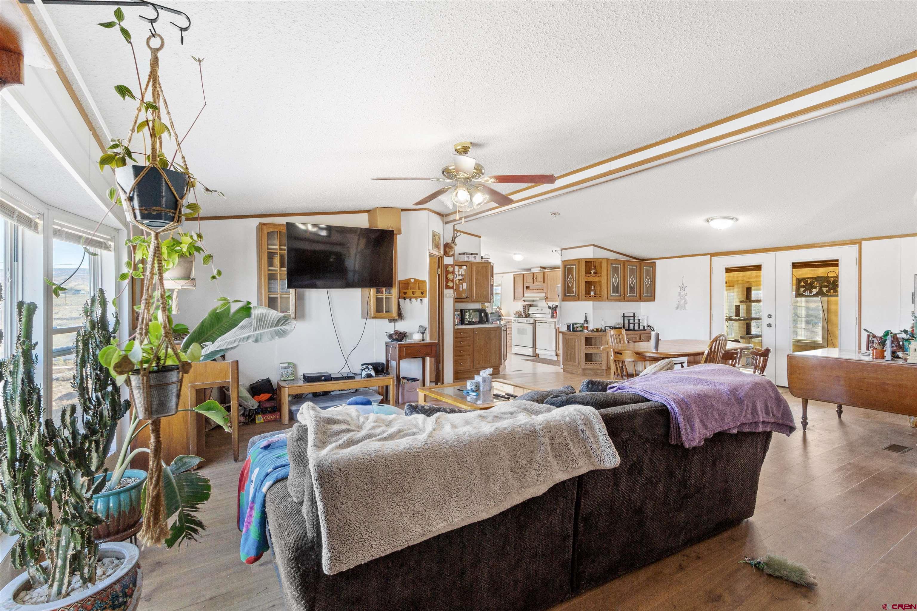 23384 D50 Road Delta, CO 81416 - Photo 20 of 37 a living room with furniture and a flat screen tv