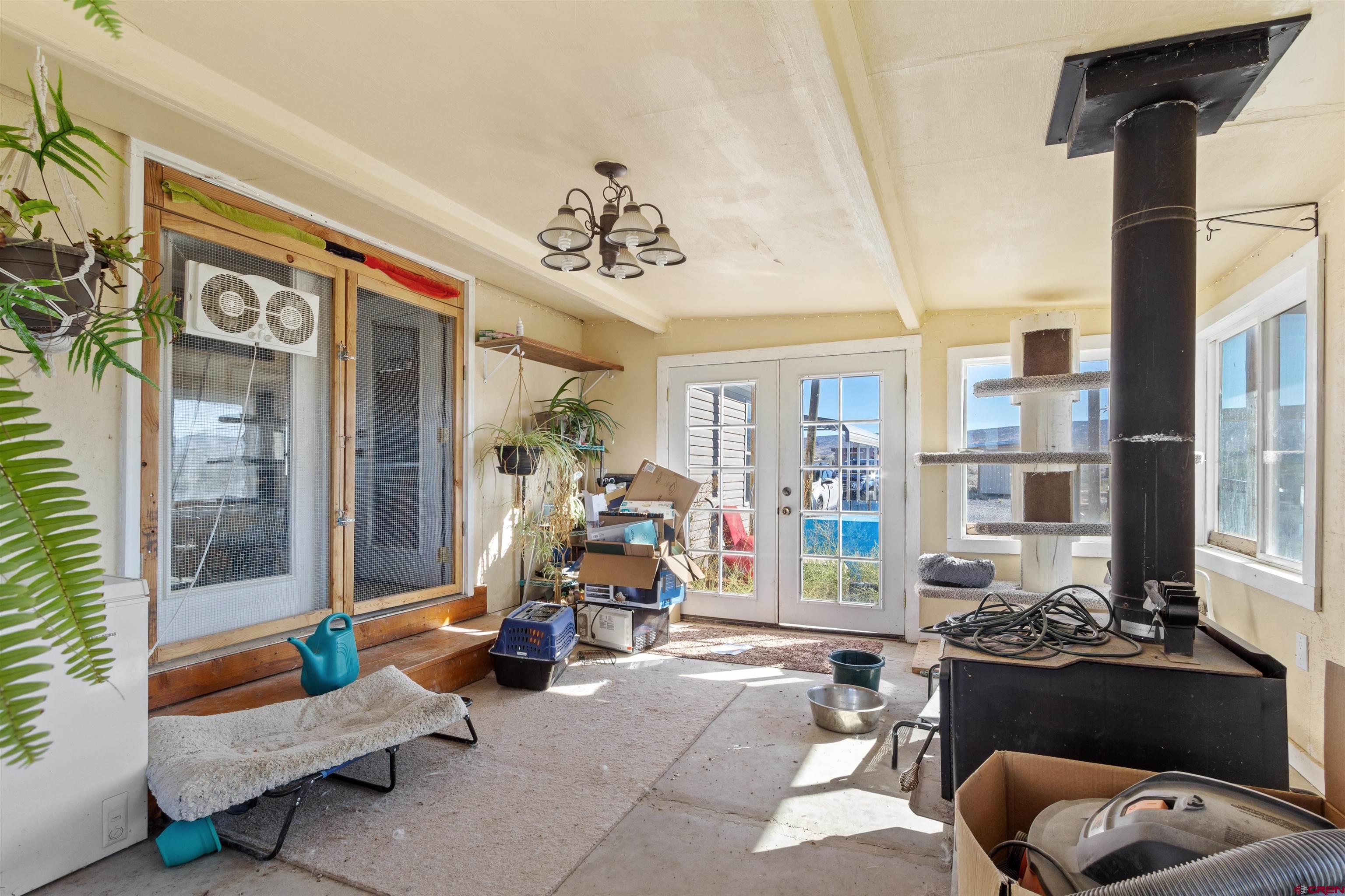 23384 D50 Road Delta, CO 81416 - Photo 32 of 37 a living room with furniture a window and gym equipment