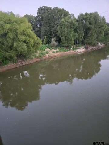 a view of lake with green space