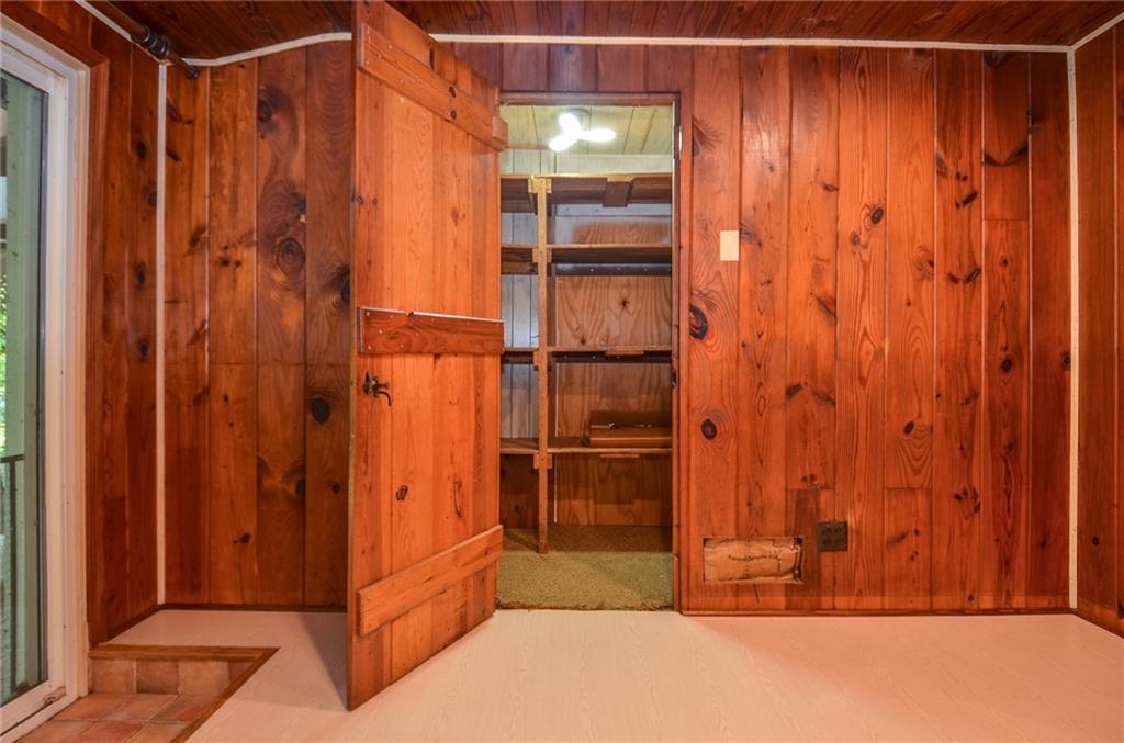 716 Killian Hill Road Southwest Lilburn, GA 30047 - Photo 20 of 56 a view of walk in closet with clothes