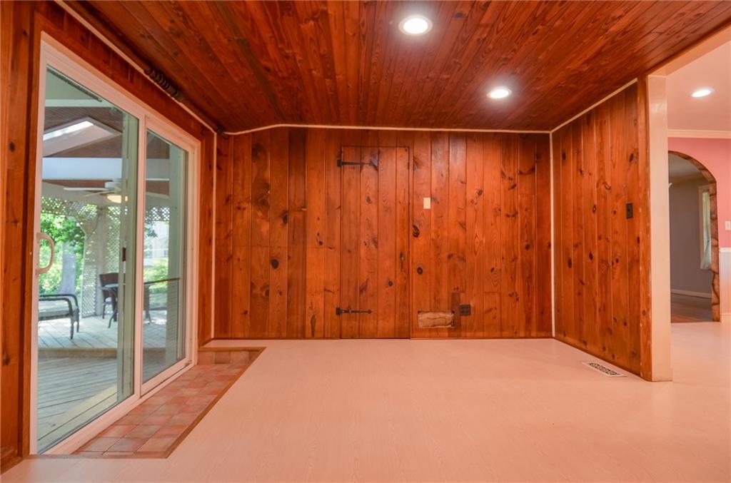 716 Killian Hill Road Southwest Lilburn, GA 30047 - Photo 22 of 56 a view of an empty room with wooden walls