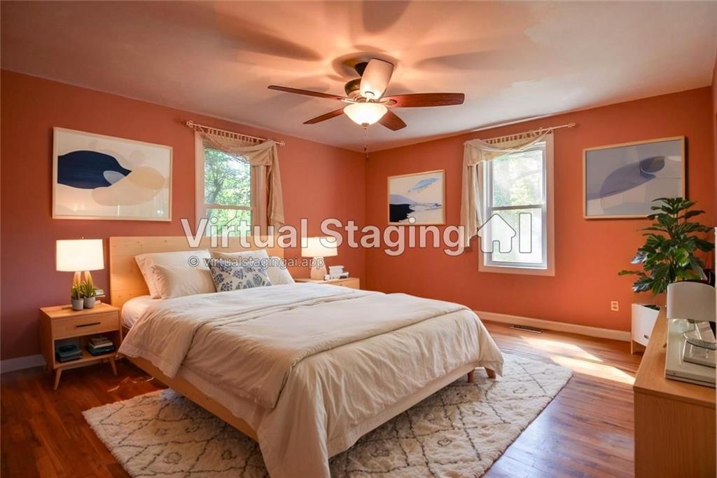 716 Killian Hill Road Southwest Lilburn, GA 30047 - Photo 25 of 56 a bedroom with a bed and a window