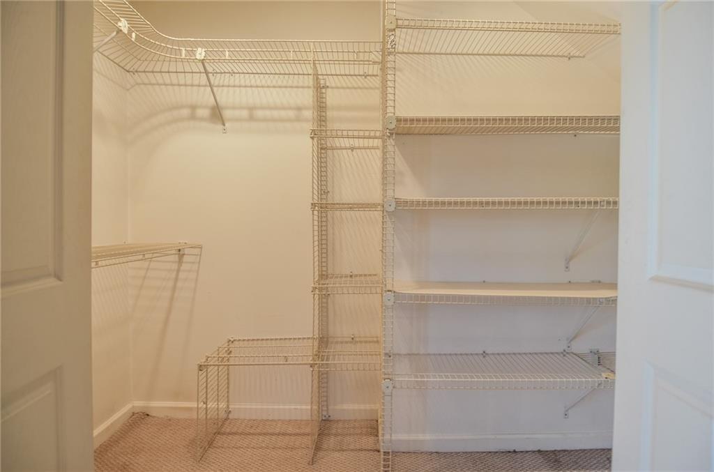 716 Killian Hill Road Southwest Lilburn, GA 30047 - Photo 29 of 56 a bathroom with a glass shower door