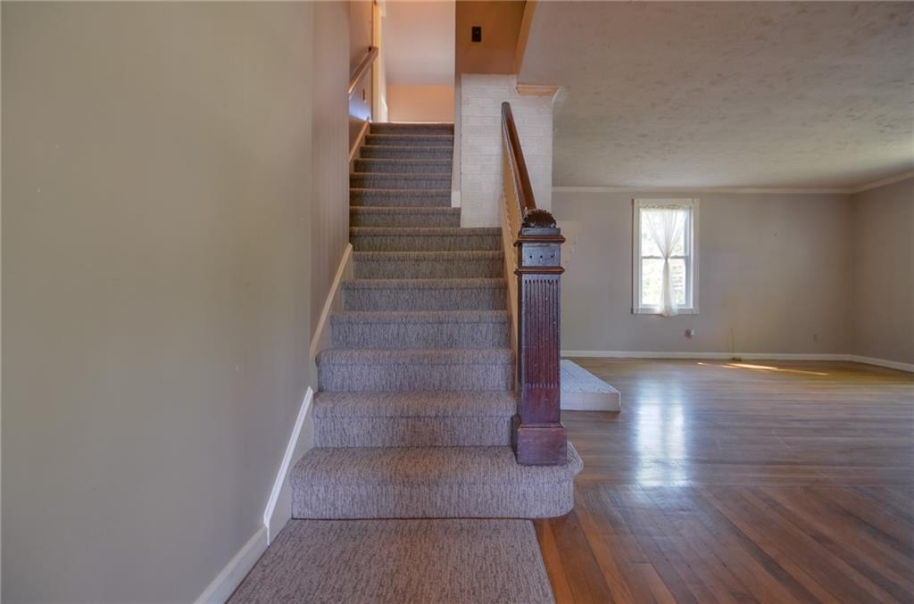 716 Killian Hill Road Southwest Lilburn, GA 30047 - Photo 33 of 56 a view of entryway and hall with wooden floor