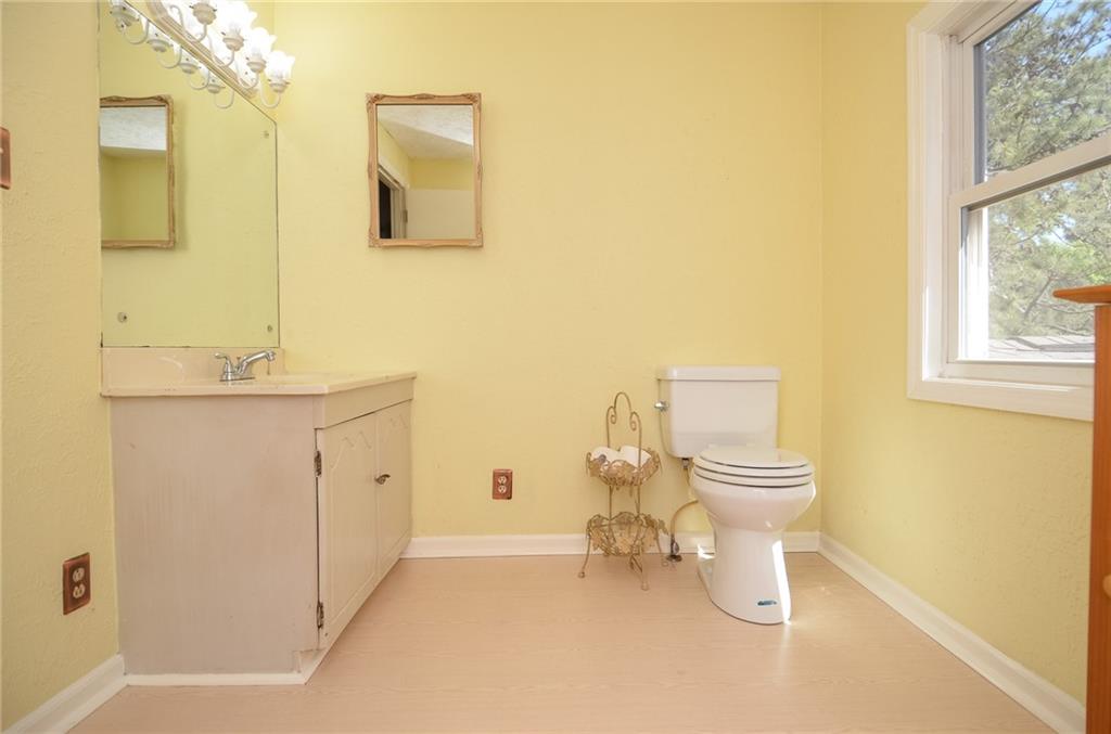 716 Killian Hill Road Southwest Lilburn, GA 30047 - Photo 42 of 56 a bathroom with a sink and a toilet