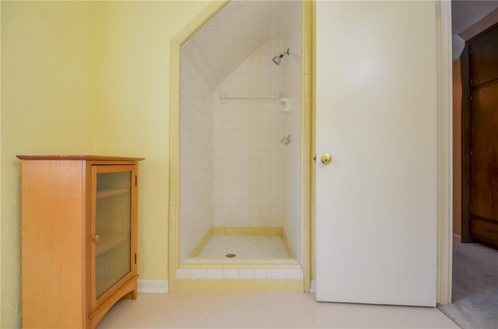 716 Killian Hill Road Southwest Lilburn, GA 30047 - Photo 43 of 56 a bathroom with a shower