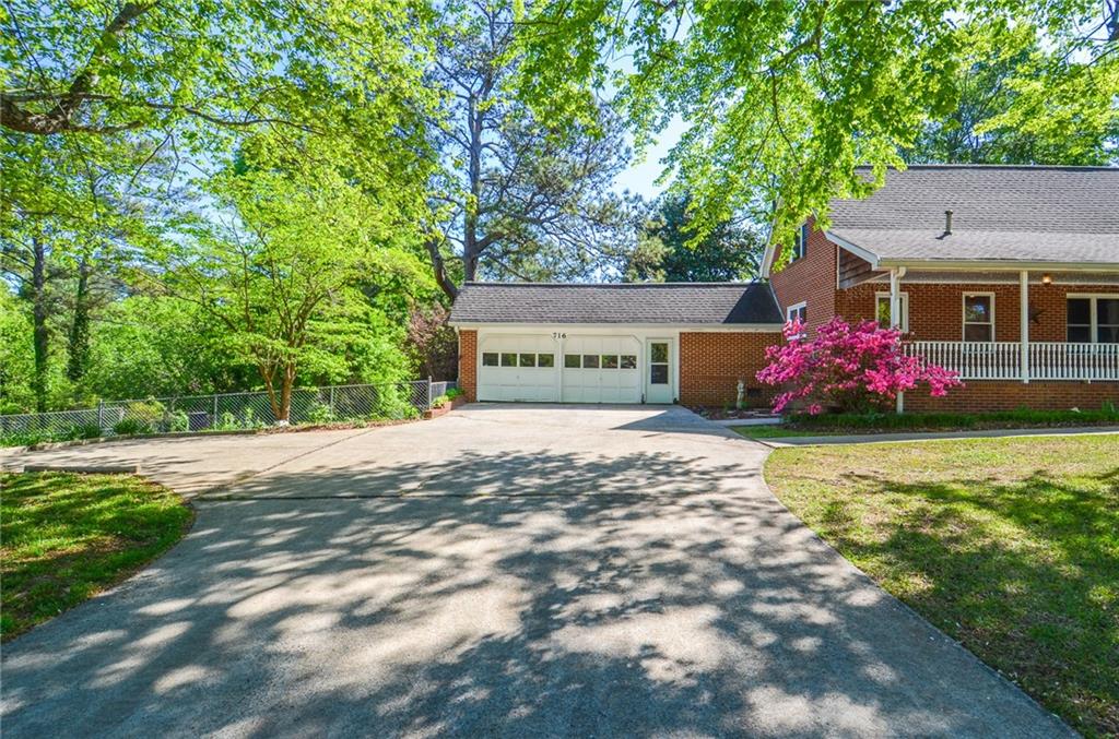 716 Killian Hill Road Southwest Lilburn, GA 30047 - Photo 5 of 56 a front view of house with yard