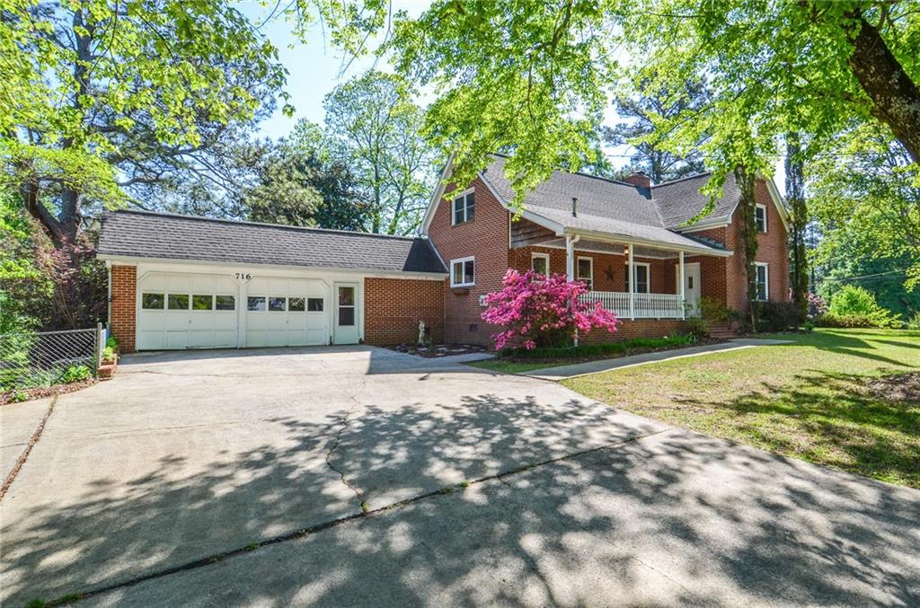 716 Killian Hill Road Southwest Lilburn, GA 30047 - Photo 6 of 56 front view of a house with a street
