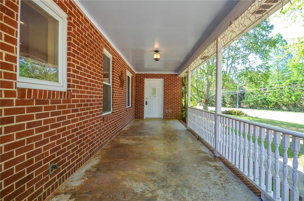 716 Killian Hill Road Southwest Lilburn, GA 30047 - Photo 8 of 56 a view of a porch