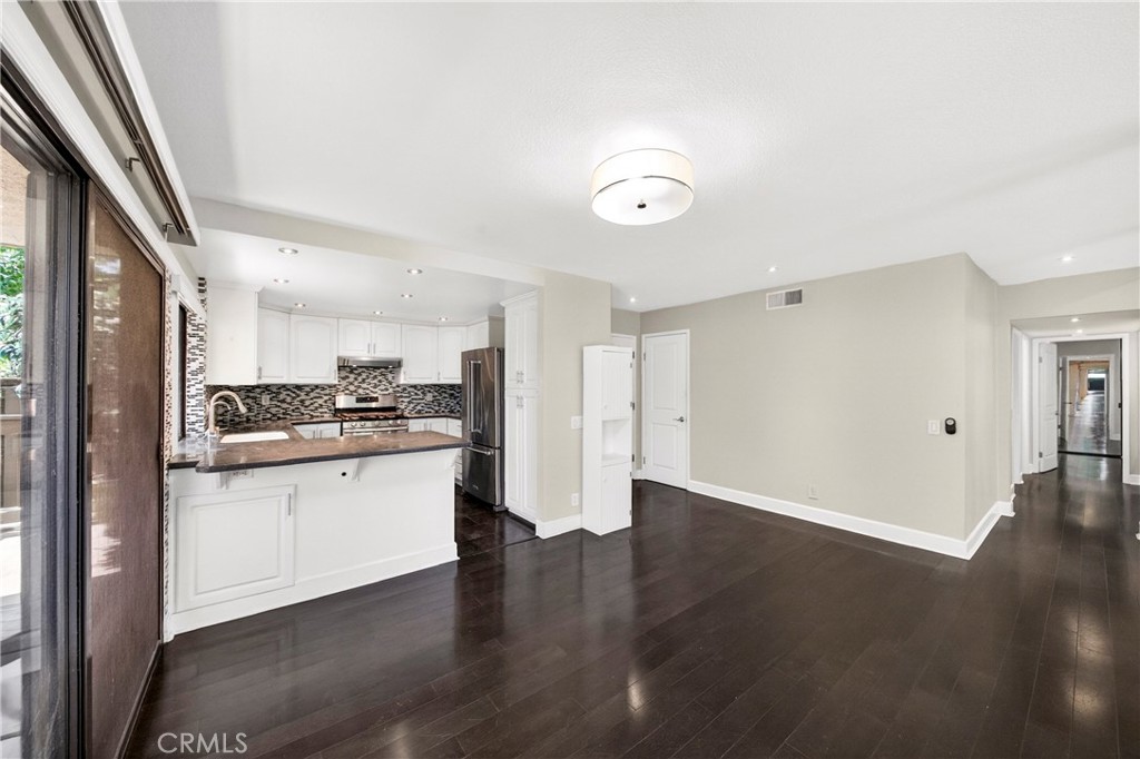 9 Madrona Irvine, CA 92612 - Photo 9 of 38 a view of a kitchen with a sink and a refrigerator