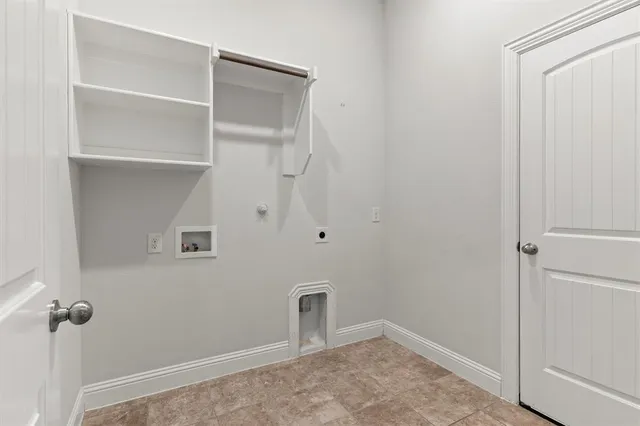 a kitchen with a stove top oven and sink