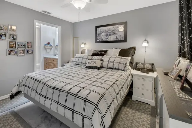 a bed room with a bed and a night stand