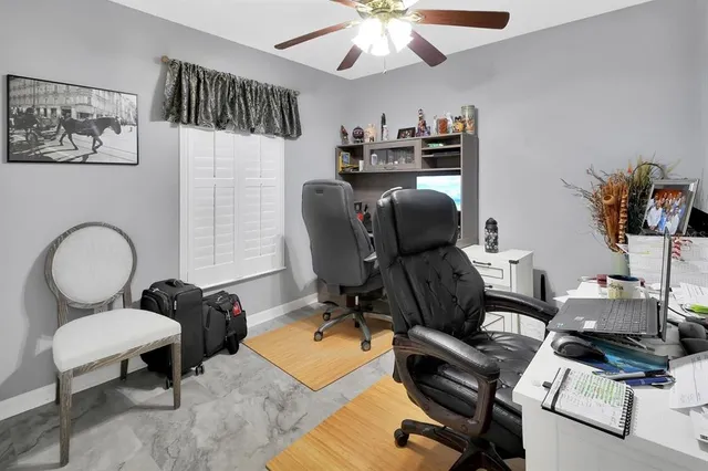 a view of a workspace with furniture and a workspace