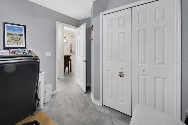 a view of a hallway with closet area