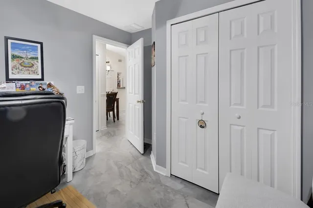 a view of a hallway with closet area