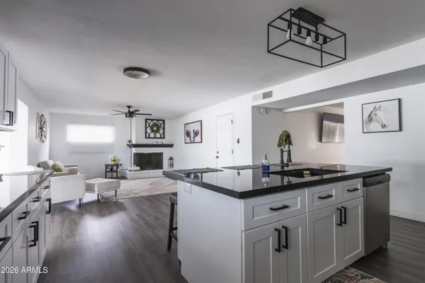 a kitchen with sink and cabinets