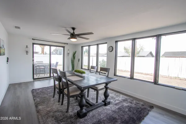 a view of a dining room with furniture window and wooden floor