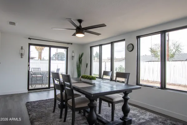 a view of a dining room with furniture and window