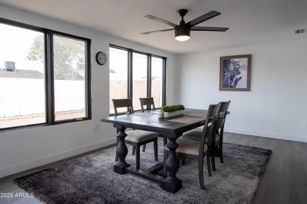 a view of a dining room with furniture window and outside view