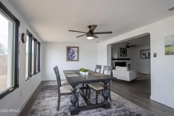 a view of a dining room with furniture and a window