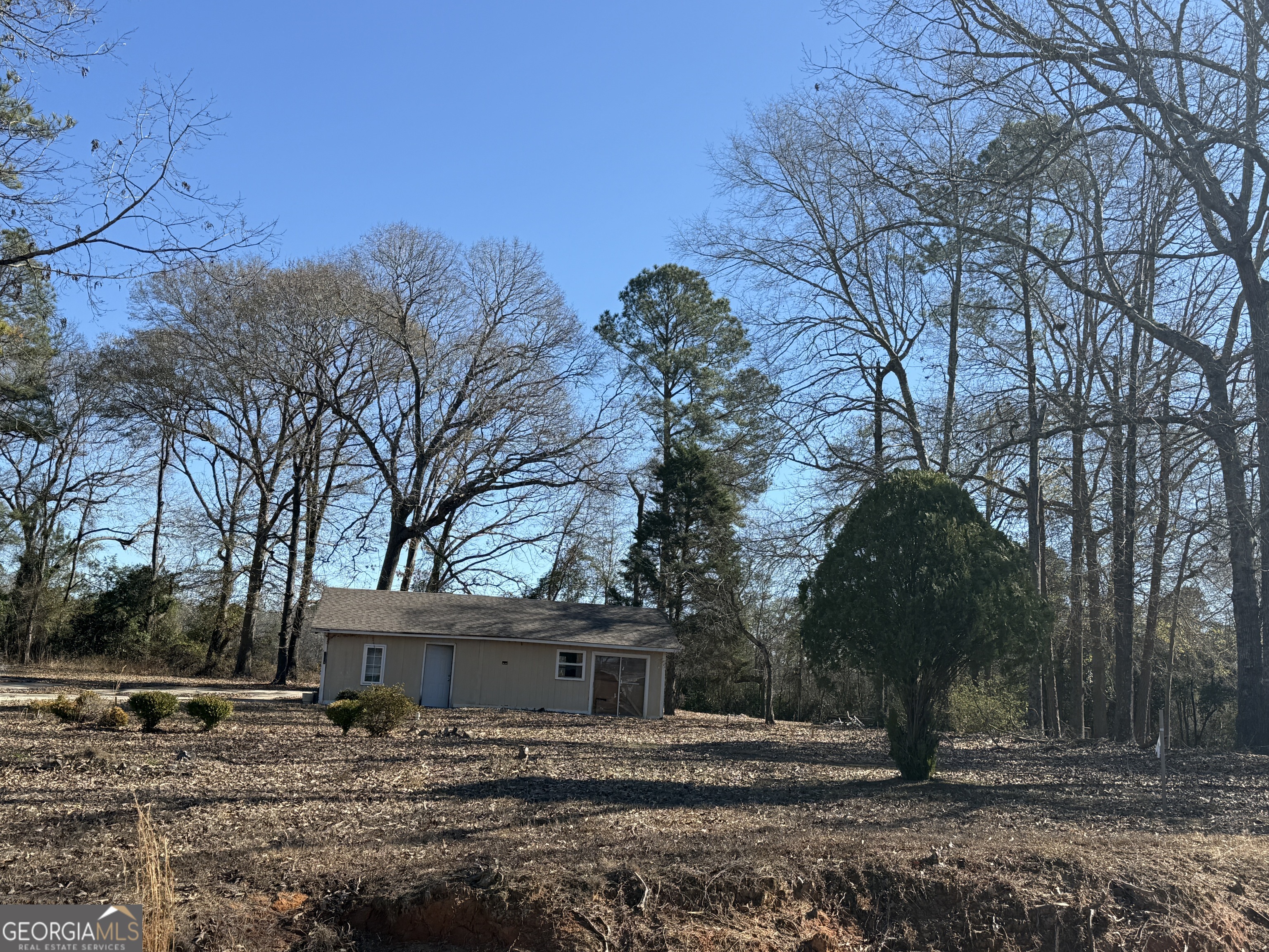 102 Canion Place Kathleen, GA 31047 - Photo 2 of 18 a backyard of a house with lots of trees