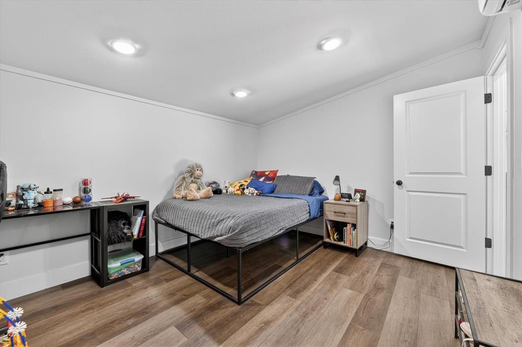 9082 Wolf Run Krum, TX 76249 - Photo 20 of 38 a bed room with a bed and furniture