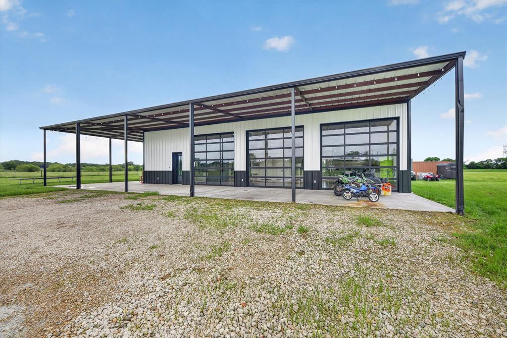 9082 Wolf Run Krum, TX 76249 - Photo 2 of 38 a view of a house with backyard and porch
