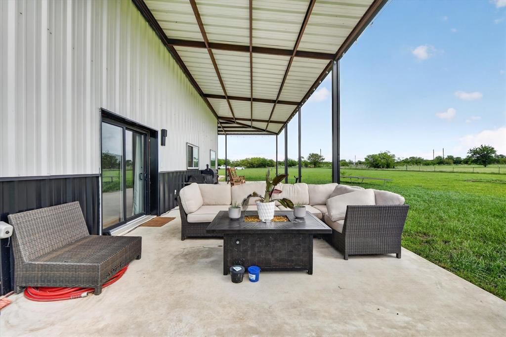 9082 Wolf Run Krum, TX 76249 - Photo 33 of 38 a outdoor living space with furniture and garden view