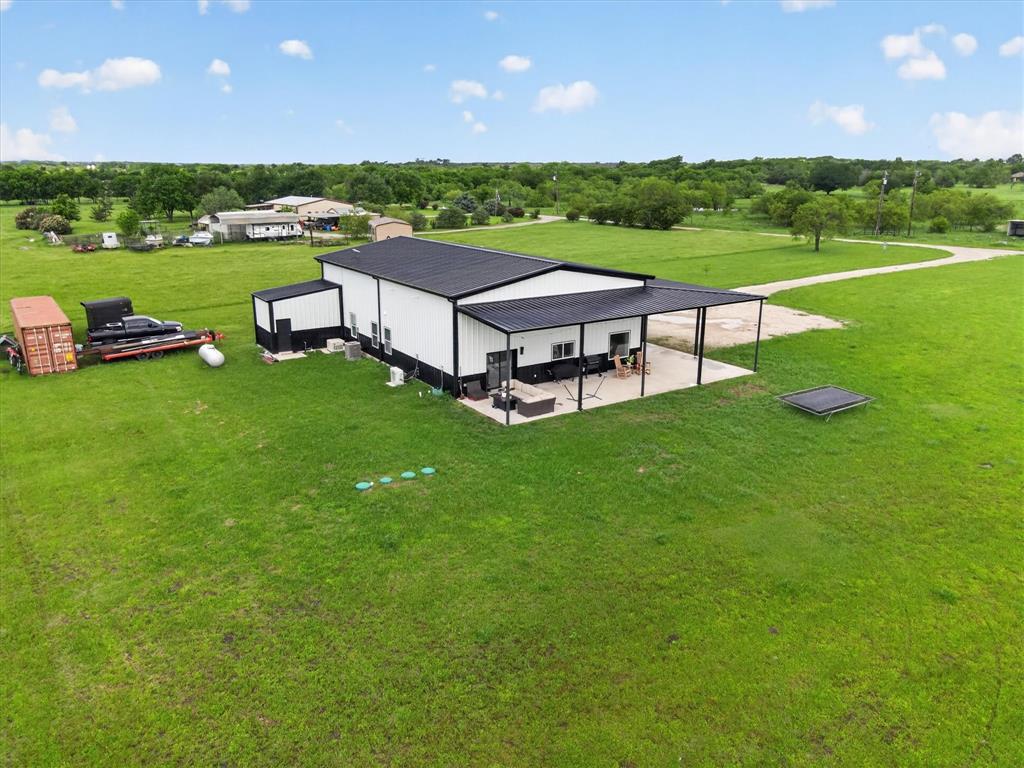 9082 Wolf Run Krum, TX 76249 - Photo 38 of 38 a view of a big room with a big yard and large trees