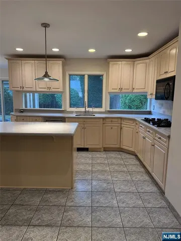 a bathroom with a sink mirror vanity and toilet