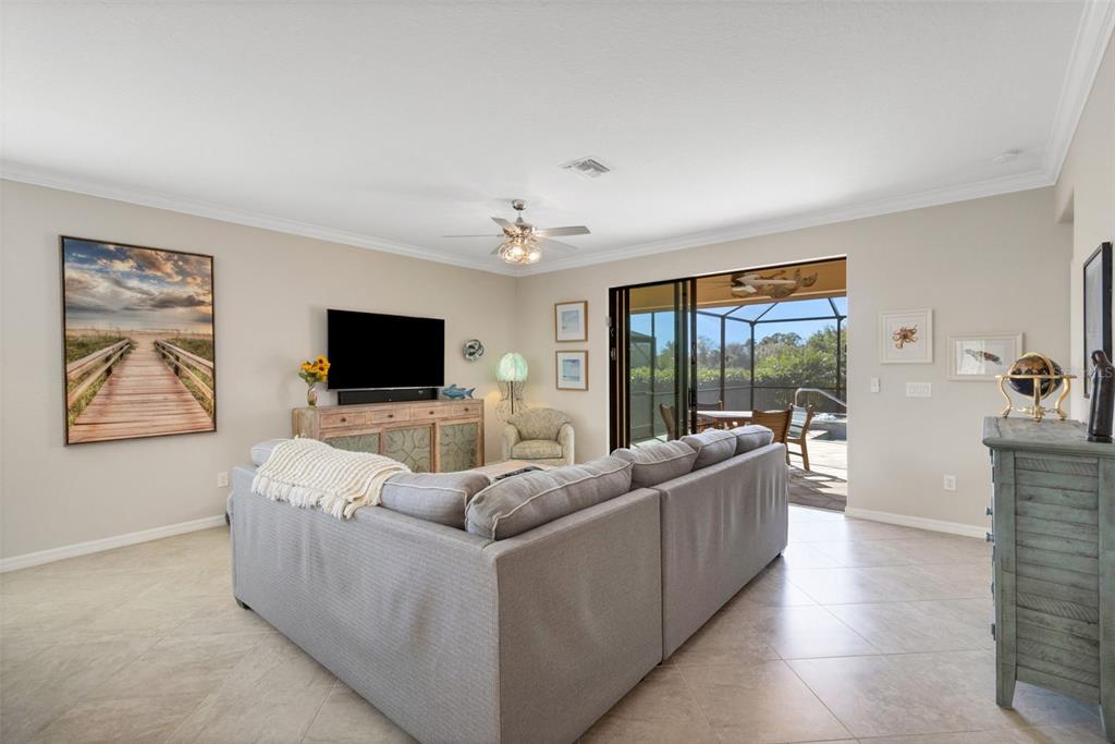 20573 Trattoria Loop Venice, FL 34293 - Photo 15 of 46 a living room with furniture and a flat screen tv