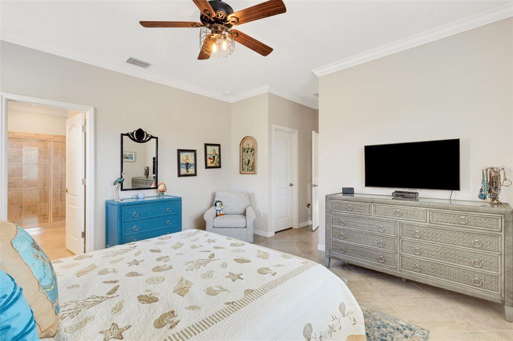 20573 Trattoria Loop Venice, FL 34293 - Photo 20 of 46 a bedroom with a bed and a flat screen tv