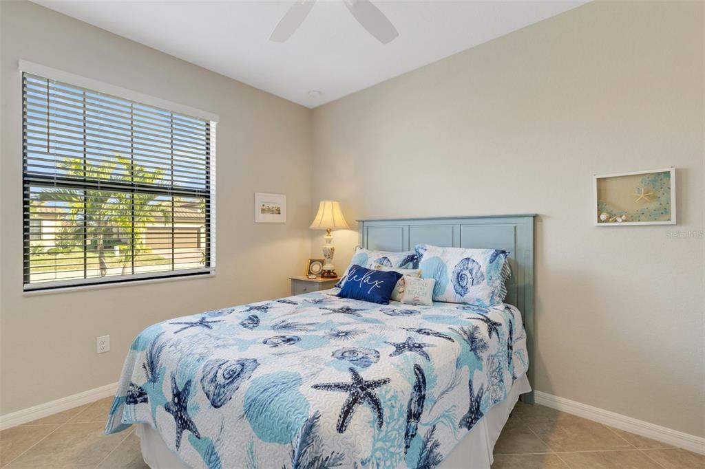20573 Trattoria Loop Venice, FL 34293 - Photo 30 of 46 a bedroom with a bed and a large window