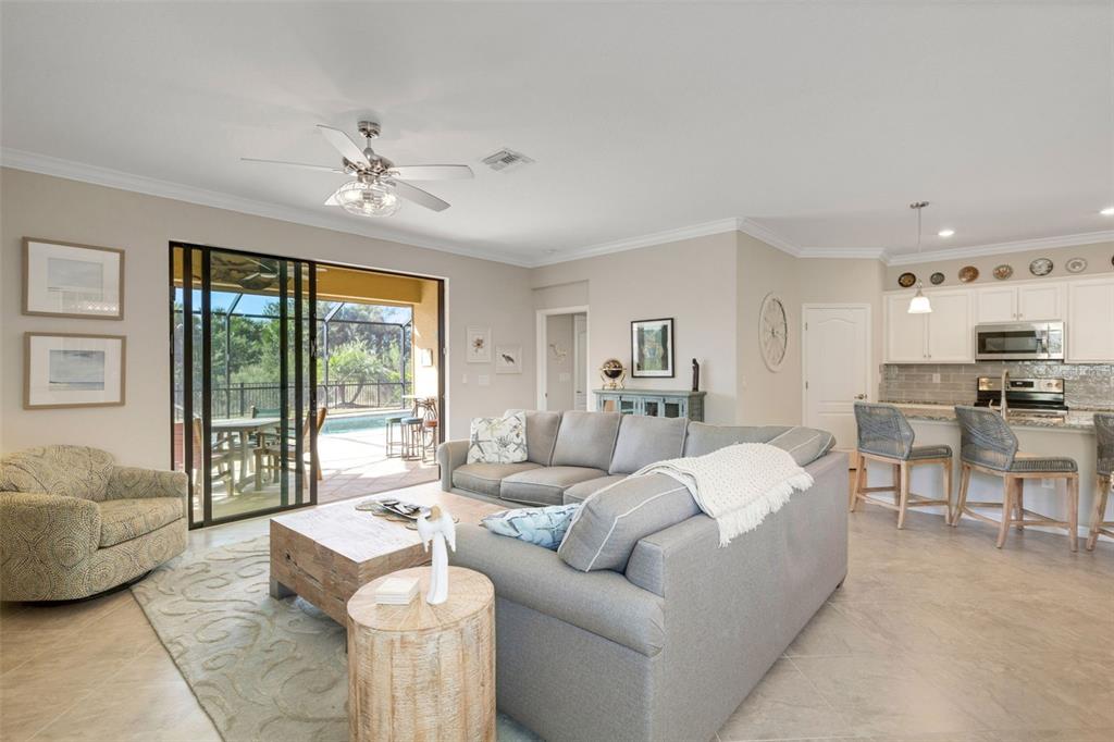 20573 Trattoria Loop Venice, FL 34293 - Photo 35 of 46 a living room with furniture and a large window