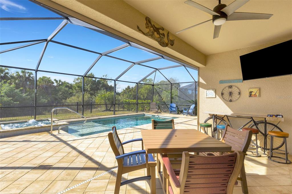 20573 Trattoria Loop Venice, FL 34293 - Photo 37 of 46 a view of a patio with a table and chairs under an umbrella