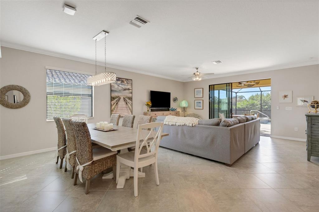 20573 Trattoria Loop Venice, FL 34293 - Photo 6 of 46 a living room with furniture a flat screen tv and a large window