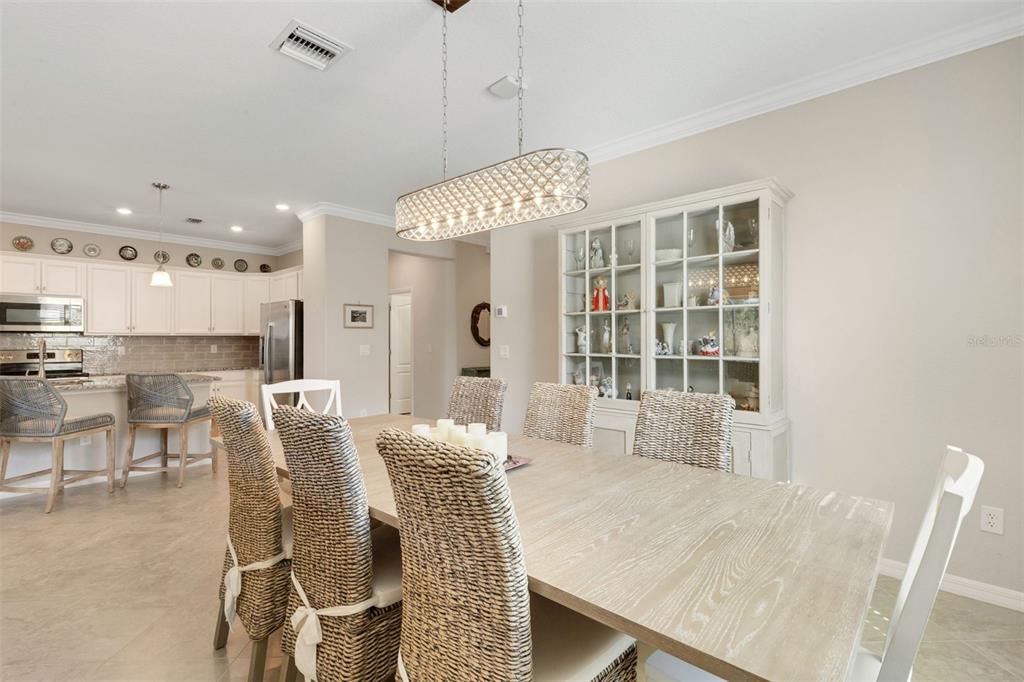 20573 Trattoria Loop Venice, FL 34293 - Photo 8 of 46 a view of a dining room with furniture and a chandelier