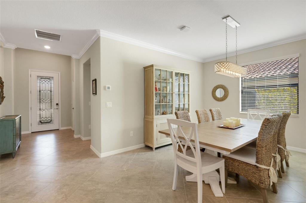 20573 Trattoria Loop Venice, FL 34293 - Photo 9 of 46 a dining room with furniture and window