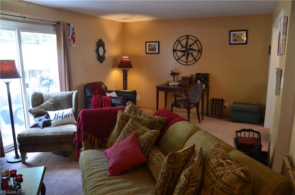 2235 Shadow Valley Road High Point, NC 27265 - Photo 2 of 18 Large Great room looks out to private courtyard patio.