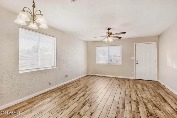 a view of an empty room with a window