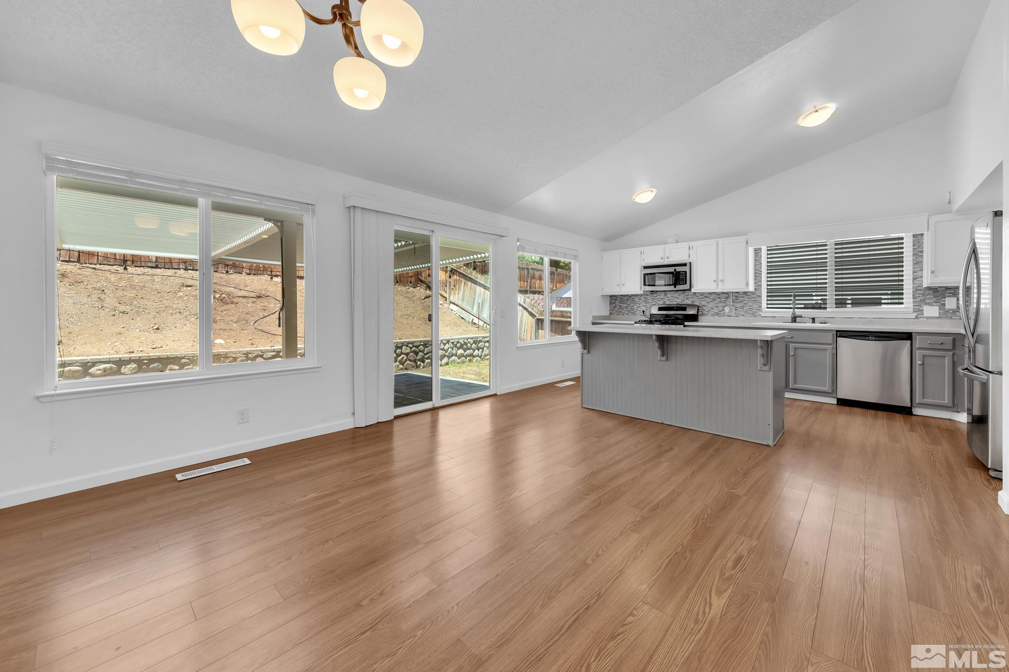 3805 Bexley Square Reno, NV 89503 - Photo 16 of 35 a view of a kitchen with a sink cabinets and wooden floor