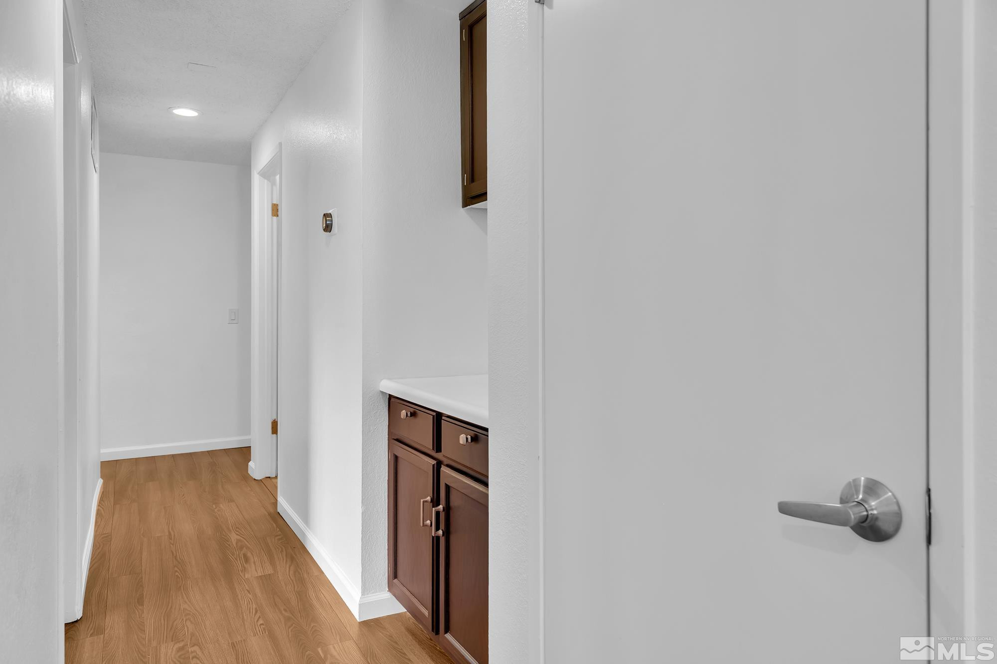 3805 Bexley Square Reno, NV 89503 - Photo 17 of 35 a view of a hallway with wooden floor and closet