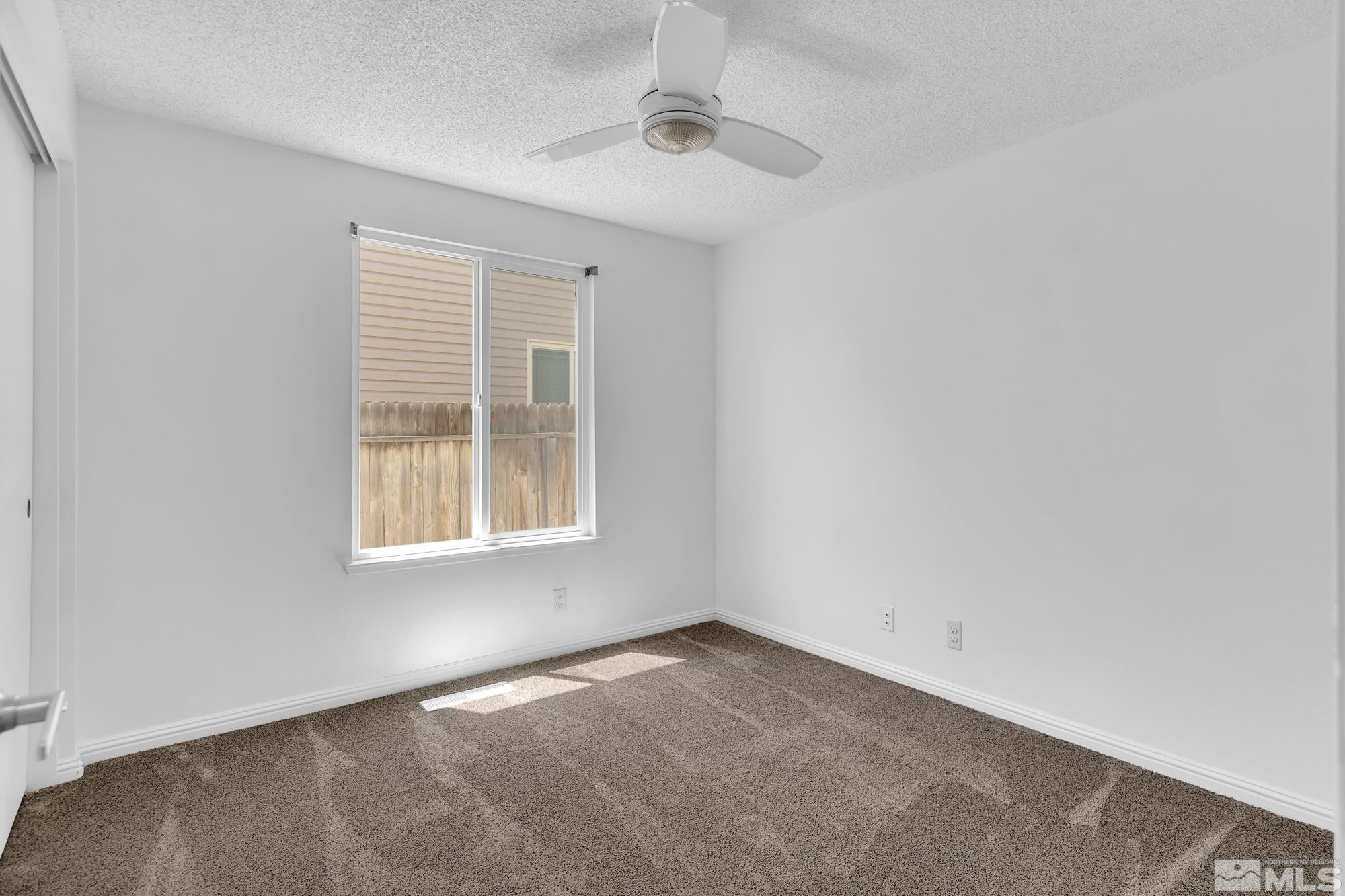 3805 Bexley Square Reno, NV 89503 - Photo 24 of 35 an empty room with a window