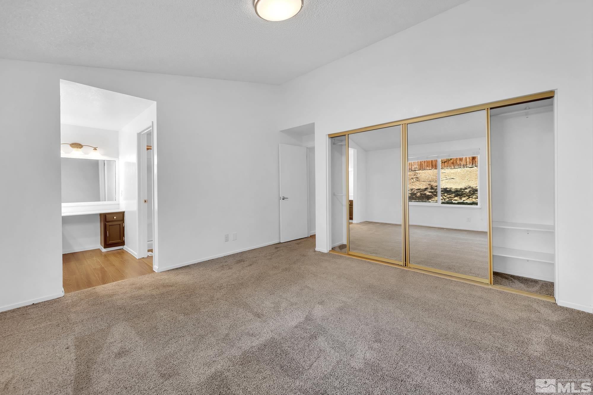3805 Bexley Square Reno, NV 89503 - Photo 25 of 35 an empty room with cabinet and mirrors